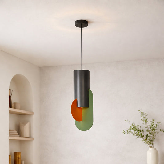 Modern pendant light with green and orange metal shades suspended from ceiling in minimal interior setting perfect for contemporary home decor lighting.