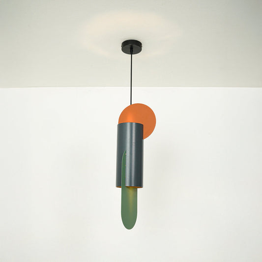 Modern pendant light with green metal cylinder and orange accent hanging from ceiling on neutral wall background ideal for contemporary interior lighting.