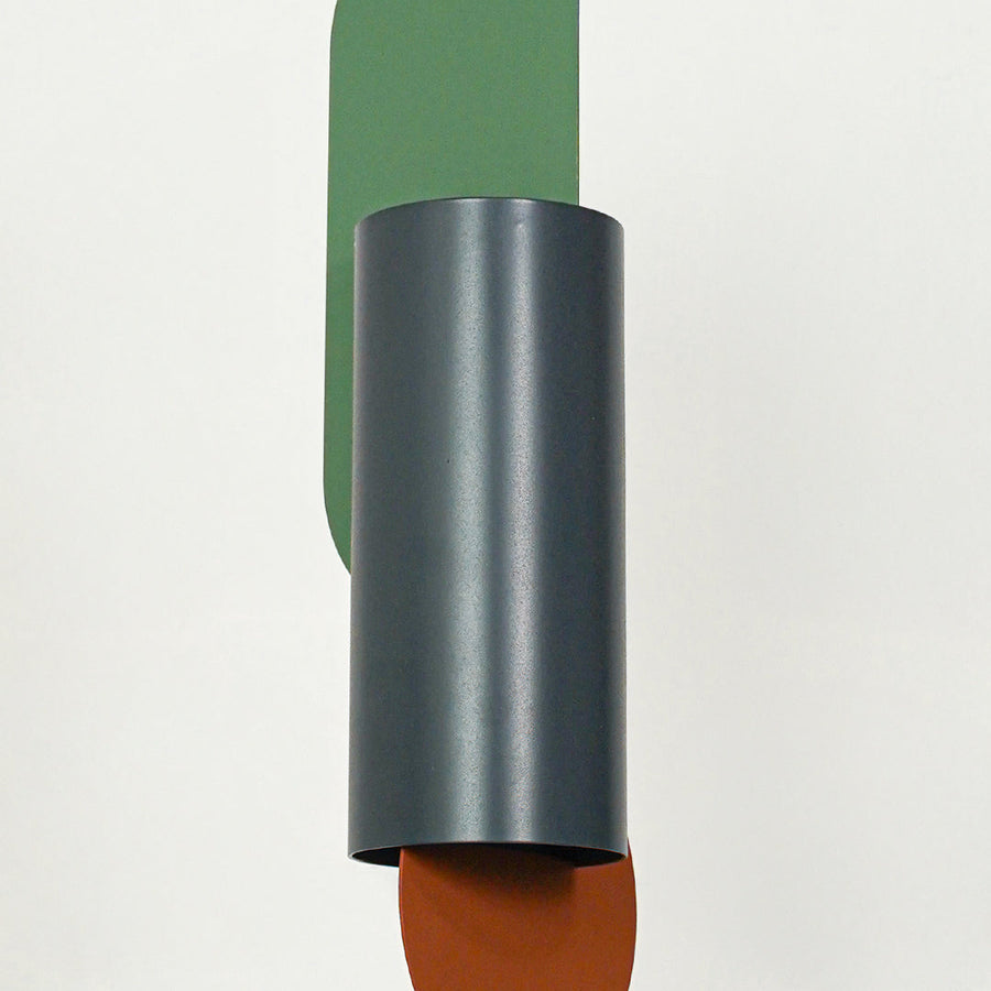 Closeup of charcoal metal pendant light highlighting colorful details and premium craftsmanship.