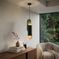 Charcoal metal pendant light with colorful accents adding playful elegance to cozy living spaces.