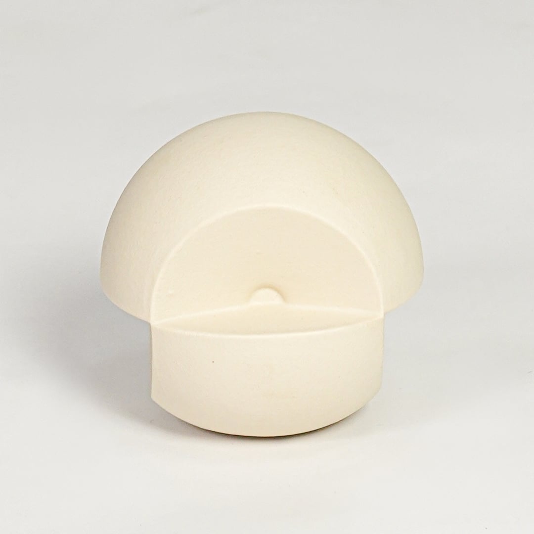 Minimal cream ceramic round decor accent with hollow front detail suitable for shelf styling tabletop display and modern interiors.