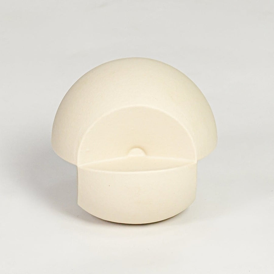 Minimal cream ceramic round decor accent with hollow front detail suitable for shelf styling tabletop display and modern interiors.