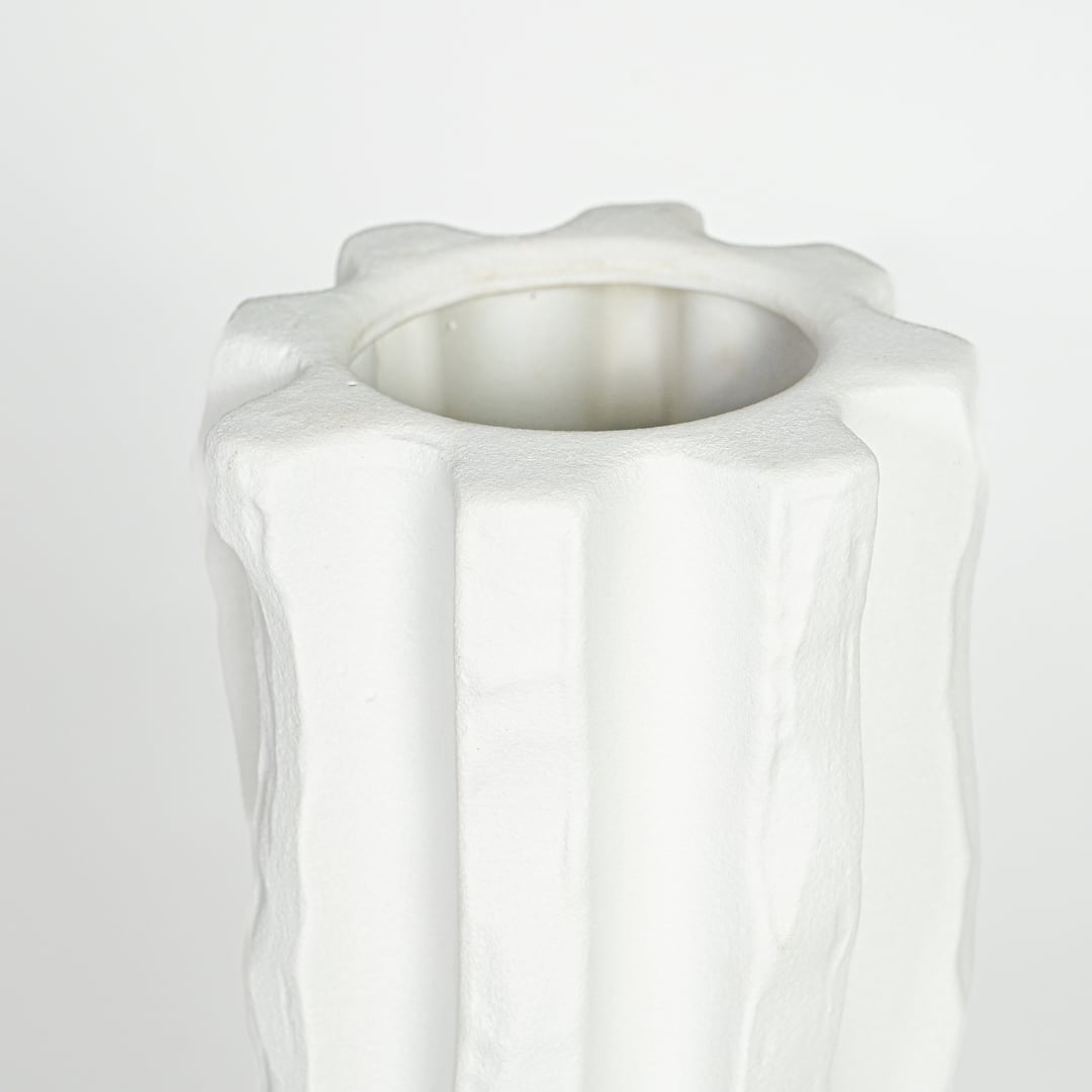 Textured white ceramic tall vase with vertical sculpted pattern for elegant interior decor styling.