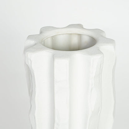 Textured white ceramic tall vase with vertical sculpted pattern for elegant interior decor styling.