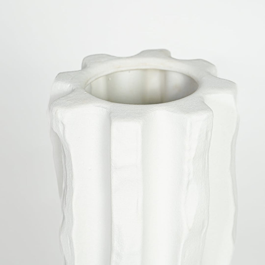 Textured white ceramic tall vase with vertical sculpted pattern for elegant interior decor styling.