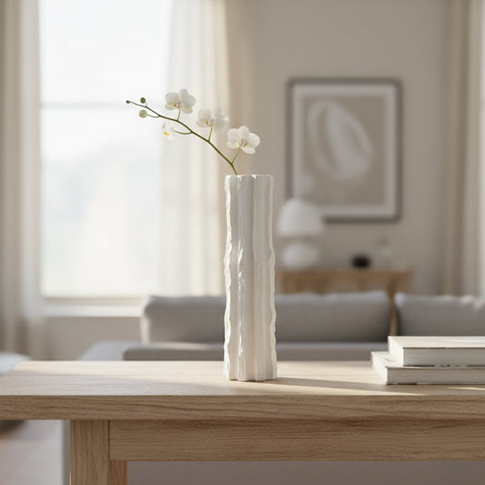 Tall white ceramic floor vase with vertical textured design styled in living room corner for modern decor accent.
