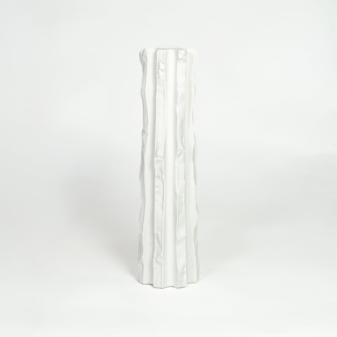 Modern white ceramic statement floor vase with minimalist textured finish for luxury home interiors.