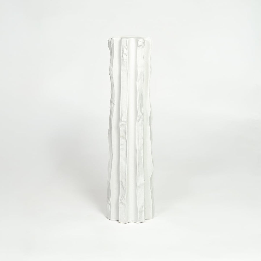 Modern white ceramic statement floor vase with minimalist textured finish for luxury home interiors.