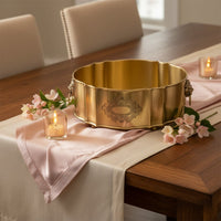 Gold metal decorative bowl lifestyle image with floral styling for elegant luxury dining table decor.