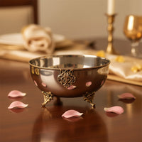 Silver metal decorative bowl lifestyle image with floral detailing for elegant luxury dining table styling.