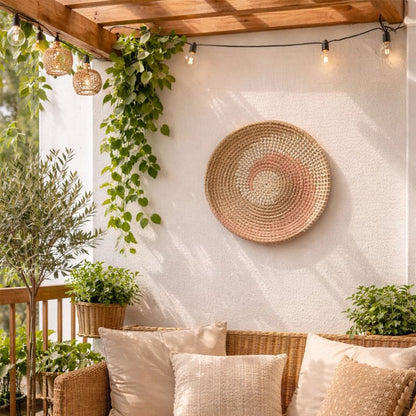 Natural spiral woven wall basket displayed above a sofa for warm bohemian wall decor and stylish home interiors.