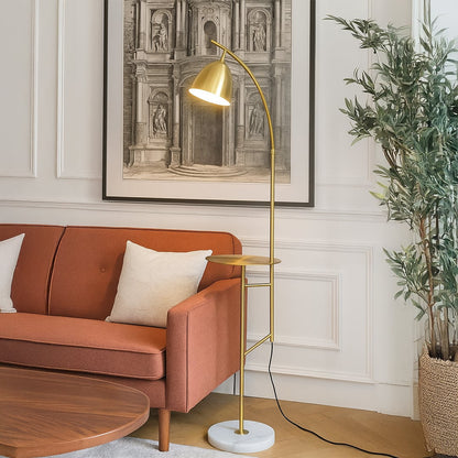 Minimal floor lamp with metal stand and angled shade placed beside orange sofa adding focused lighting to stylish living room decor.