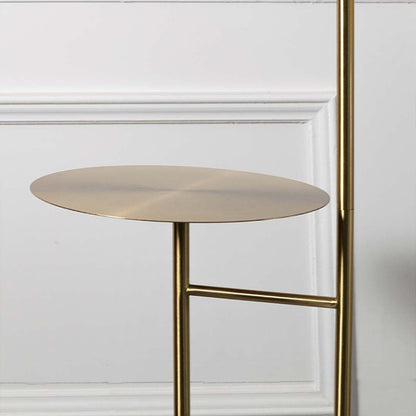 Closeup of gold floor lamp shade with metallic finish showing sleek and elegant design.