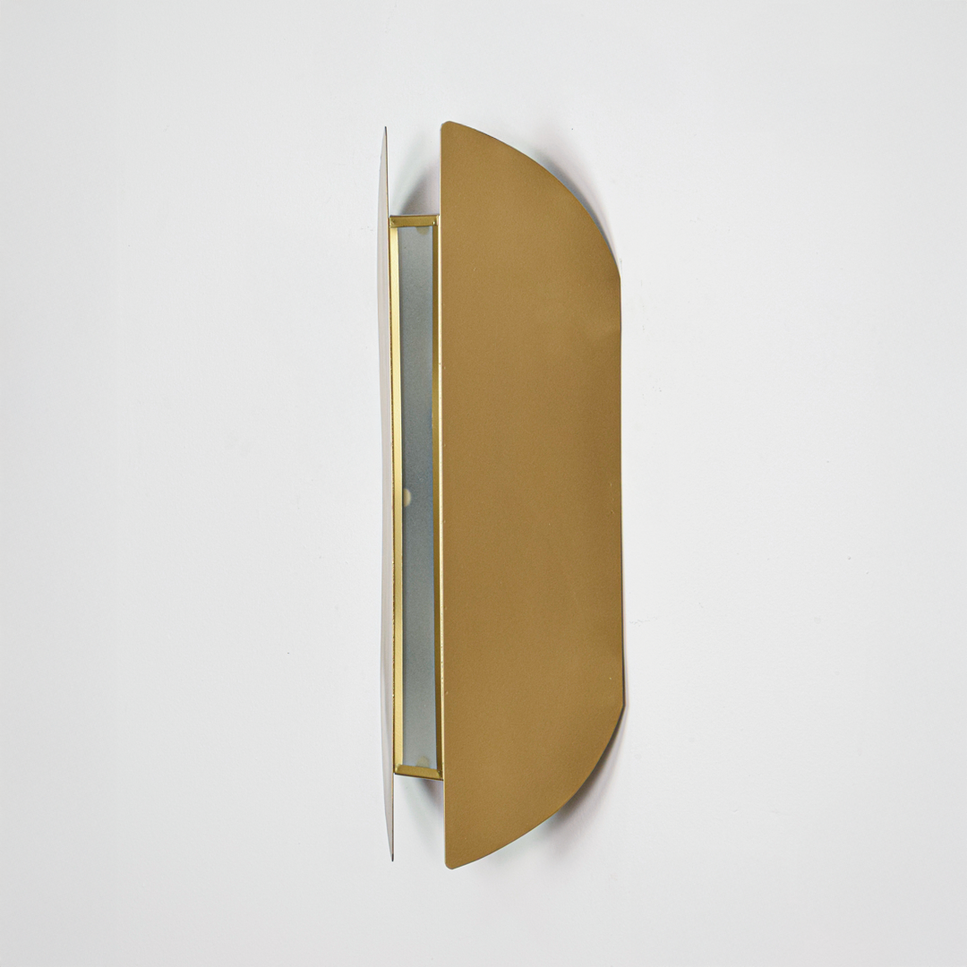 Wall light off on white background featuring slim gold metal body with modern curved profile for minimalist product display.