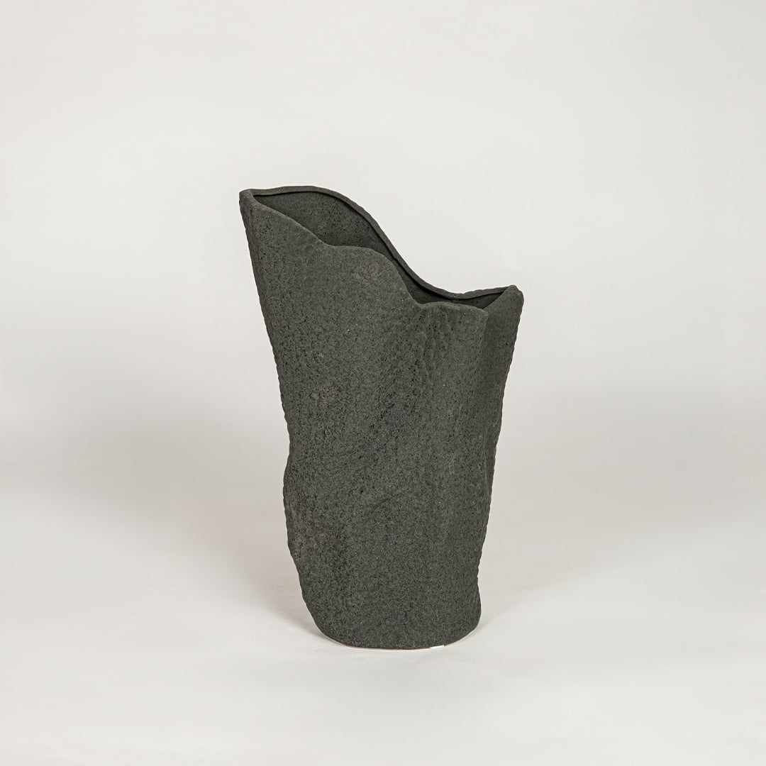 Modern black ceramic decorative floor vase with sculpted organic design ideal for living room corner and stylish home decor.