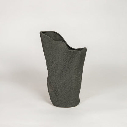 Modern black ceramic decorative floor vase with sculpted organic design ideal for living room corner and stylish home decor.