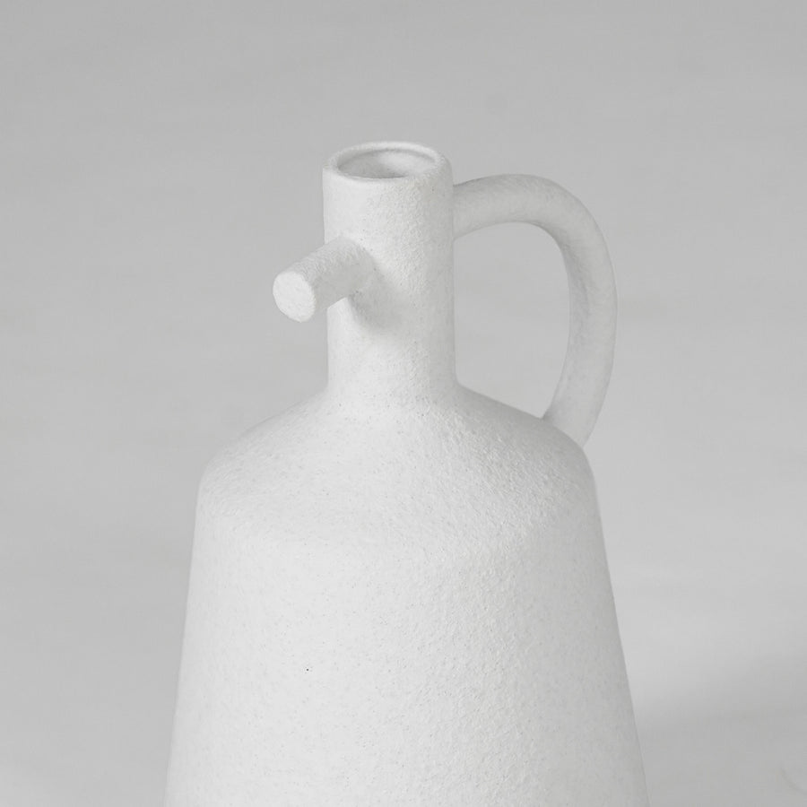 Closeup image of white ceramic bottle vase for modern tabletop decor styling with clean matte artistic finish.