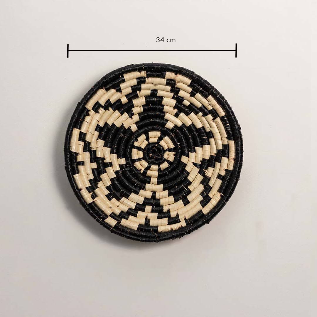 Dimension image of handcrafted black cream seagrass wall basket with geometric star pattern for bedroom boho wall décor.