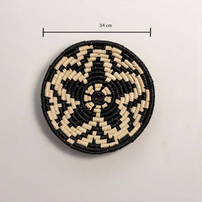Dimension image of handcrafted black cream seagrass wall basket with geometric star pattern for bedroom boho wall décor.