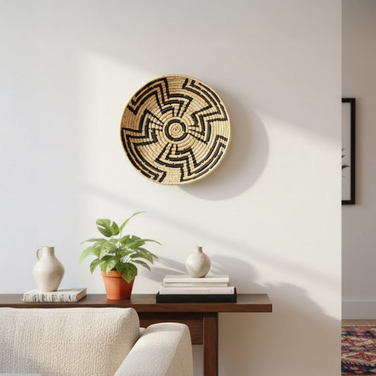 Textured round metal wall art styled on minimal shelf paired with plant decor delivering modern elegance and handcrafted charm to home interiors.