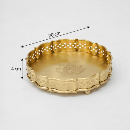 Antique gold metal serving tray with pierced scalloped edges and engraved center designed for elegant table decor.