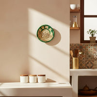 Minimal ceramic wall decor plate in soft neutral tone styled on modern shelf adding artistic charm texture and calm elegance to contemporary living space.