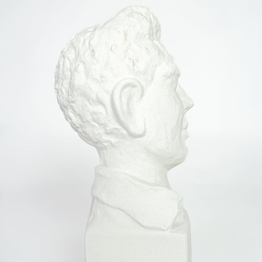 Close view of white resin bust sculpture highlighting detailed facial features and smooth matte finish.