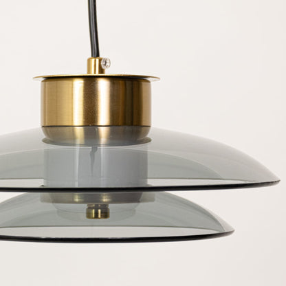 Close detailed view of grey glass pendant highlighting the smooth layered glass shade and premium gold metal fitting for modern interior styling.