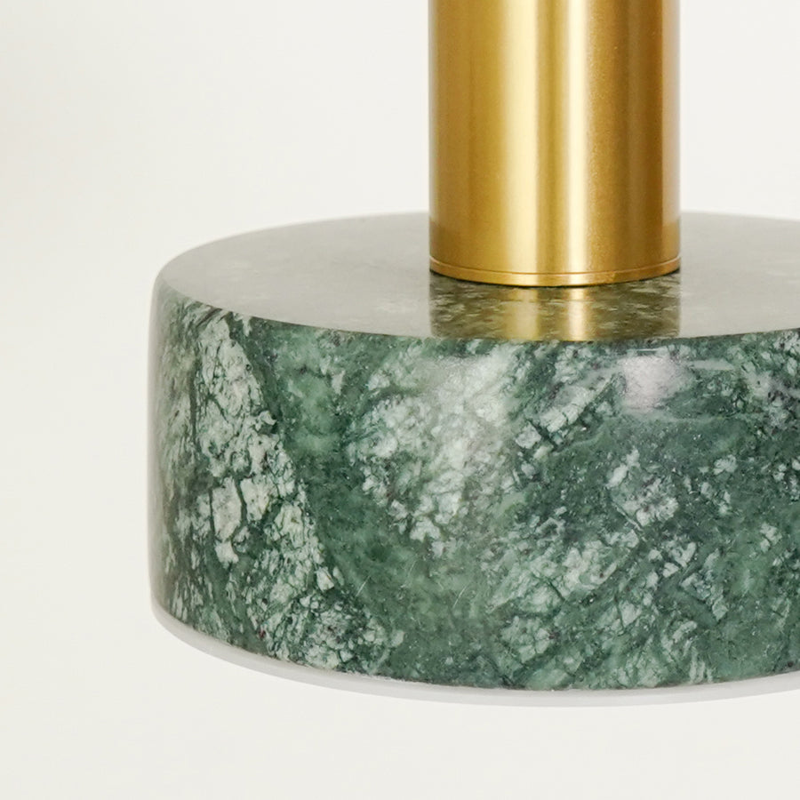 Closeup of brass and green marble pendant light with natural stone finish for elegant modern interior lighting.