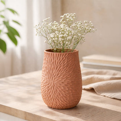 Green ribbed ceramic double tube flower vase with white flowers placed on living room table styled for modern home decor.