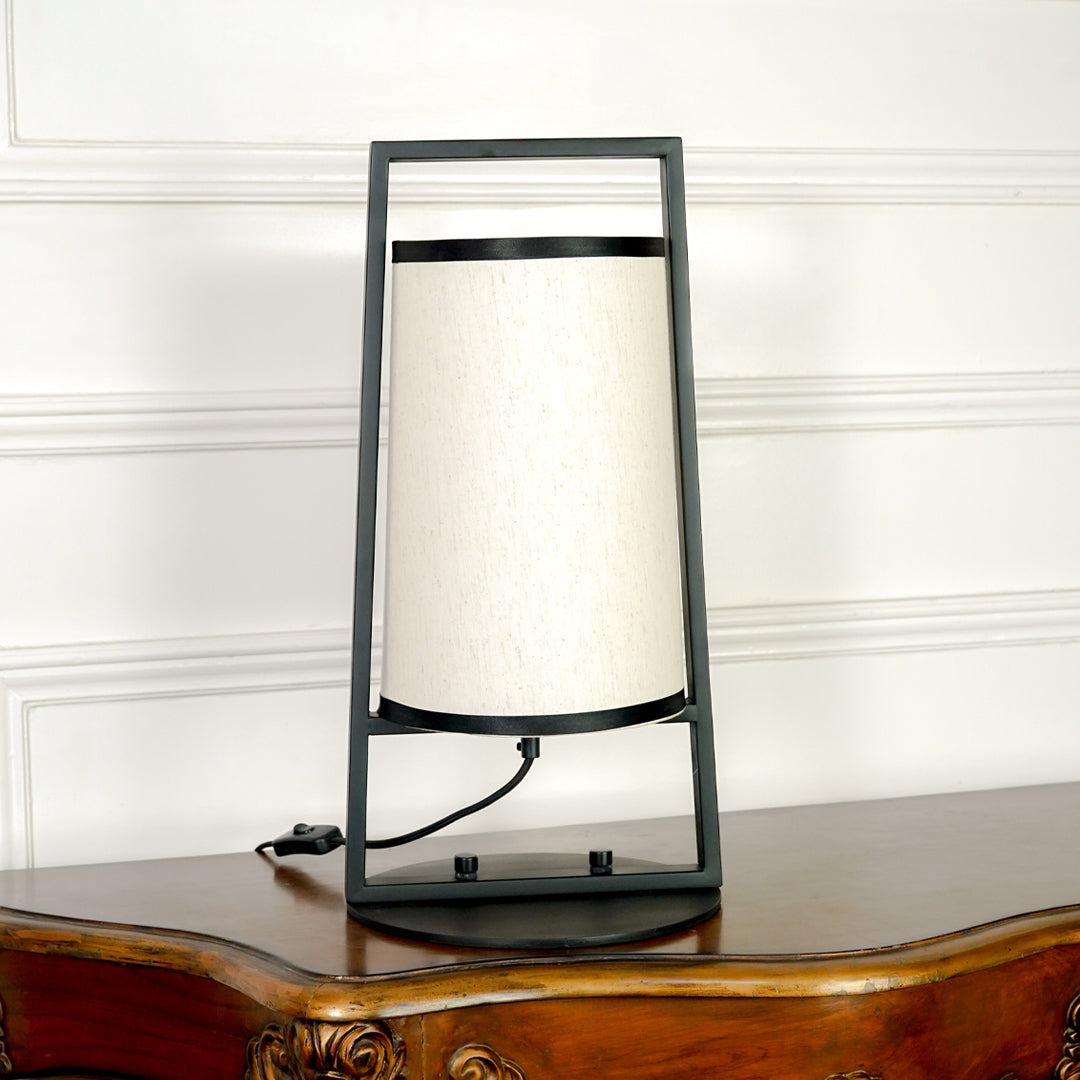 White background image of sleek metal table lamp for elegant bedroom decor styling and modern home interior lighting setup.
