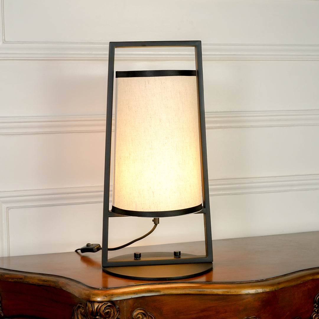 White background image of bright illuminated metal table lamp for elegant bedroom decor styling and modern home lighting.