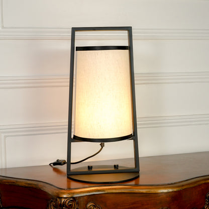 White background image of bright illuminated metal table lamp for elegant bedroom decor styling and modern home lighting.