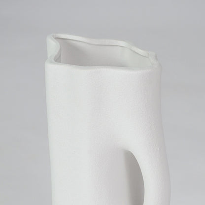 Closeup image of white ceramic abstract jug vase for modern tabletop decor styling with smooth matte finish.