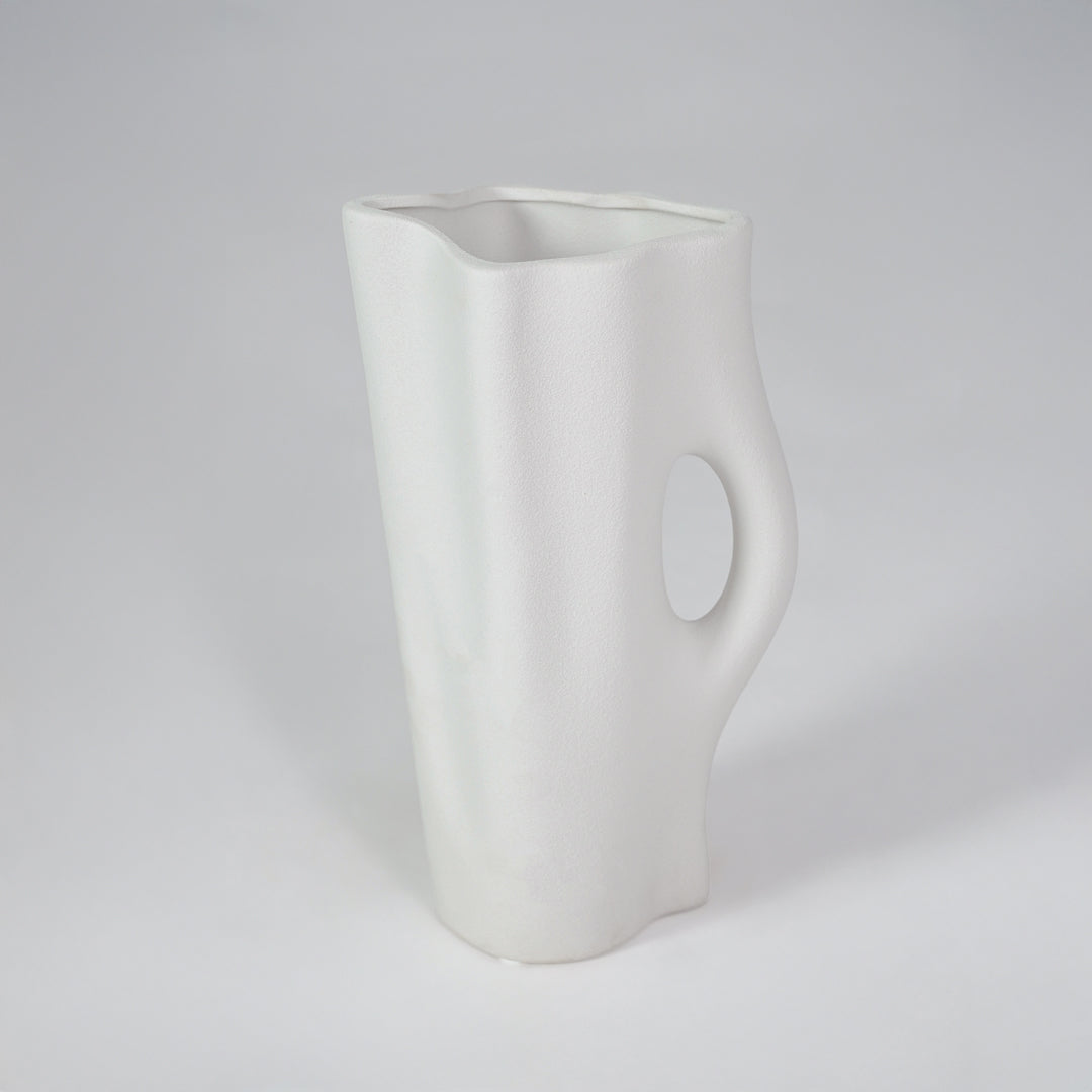 White background image of white ceramic decorative vase for modern shelf placement with artistic matte finish.