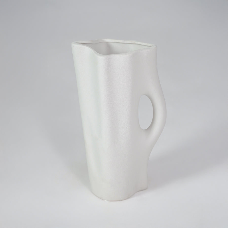 White background image of white ceramic decorative vase for modern shelf placement with artistic matte finish.