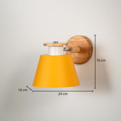 Contemporary yellow metal shade wall light with wooden mount displayed on clean white wall background perfect for modern home decor lighting.