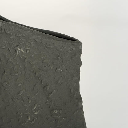 tombstone black ceramic vase closeup 1