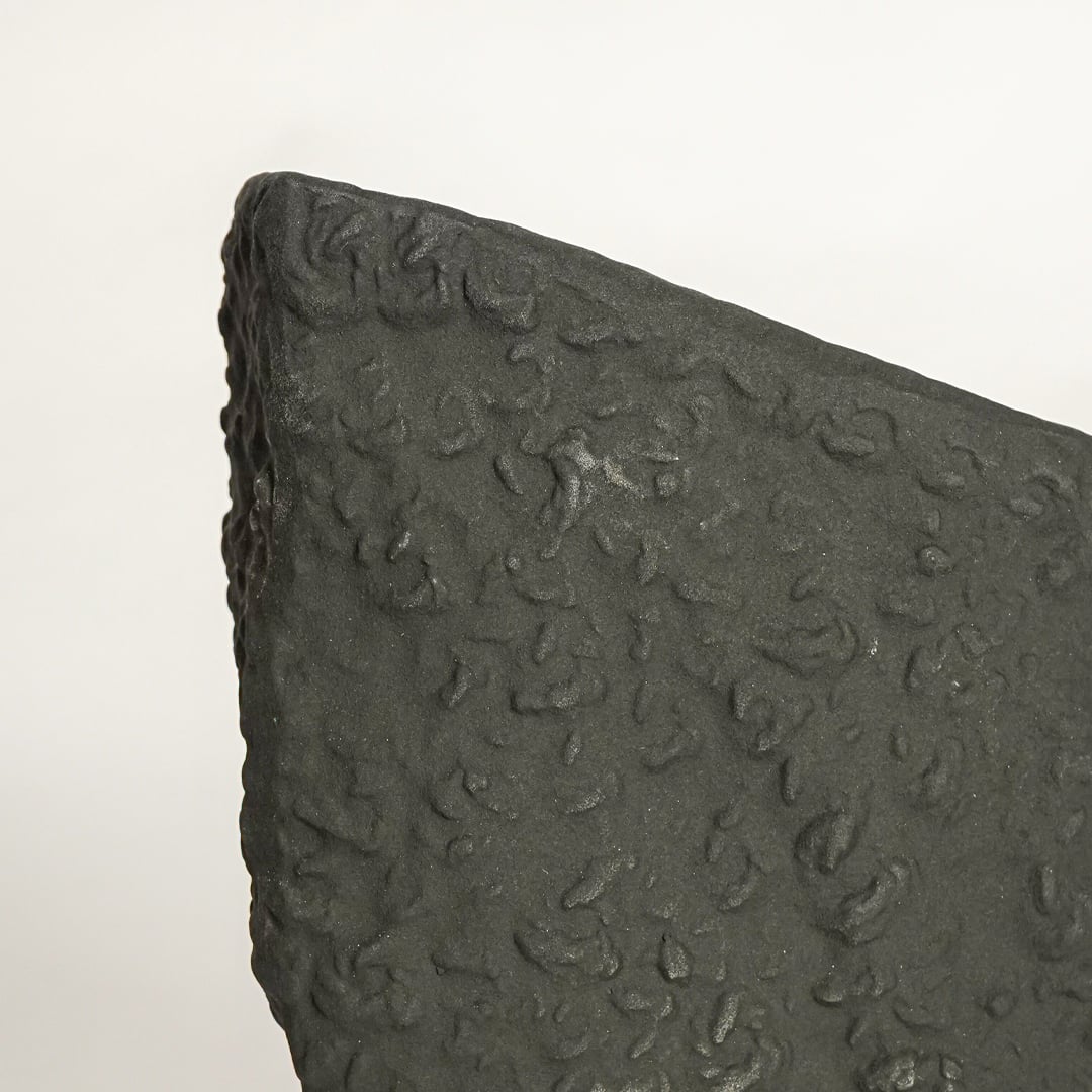 tombstone black ceramic vase closeup