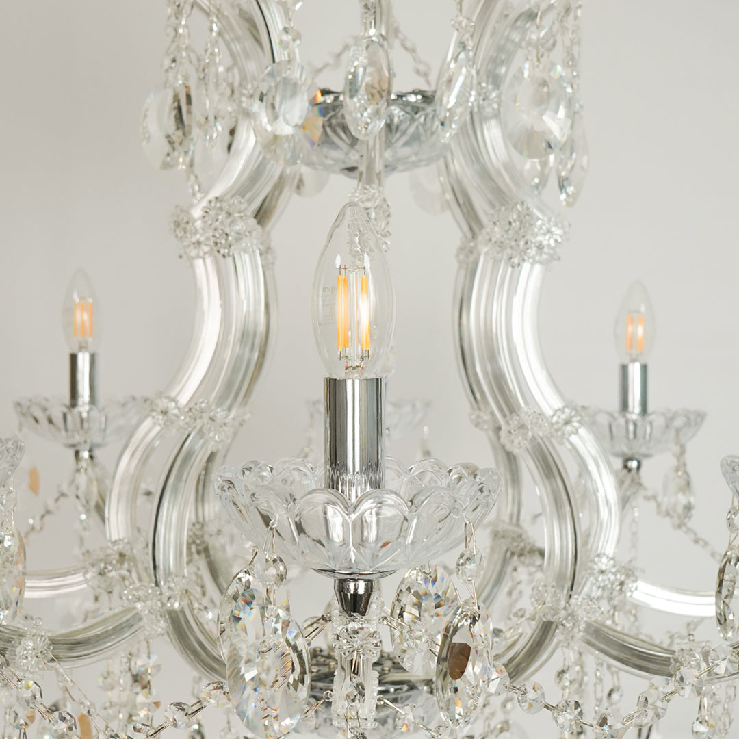 Closeup image of topaz cut-crystal chandelier for luxury living room decor styling with polished finish.