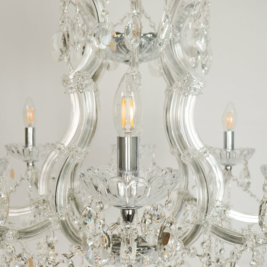 Closeup image of topaz cut-crystal chandelier for luxury living room decor styling with polished finish.