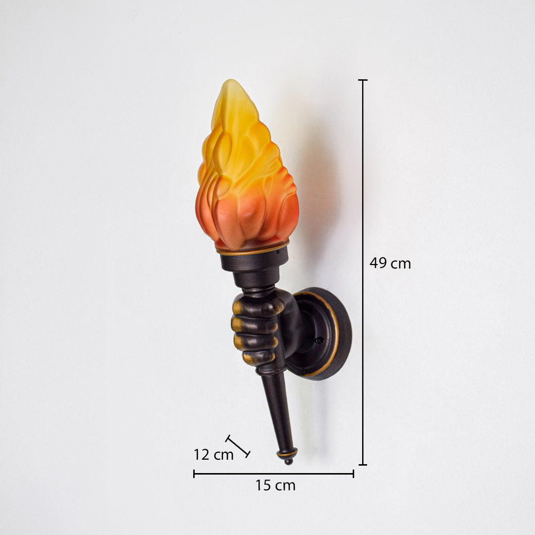 Decorative wall torch light with flame shaped glass shade and black metal holder mounted on wall 49 cm height 15 cm width 12 cm depth perfect for classic outdoor lighting.