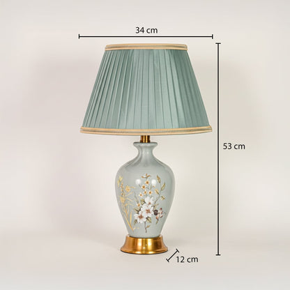 Sage green ceramic table lamp showing 53 cm height 34 cm shade width and 12 cm base size ideal for bedside placement.