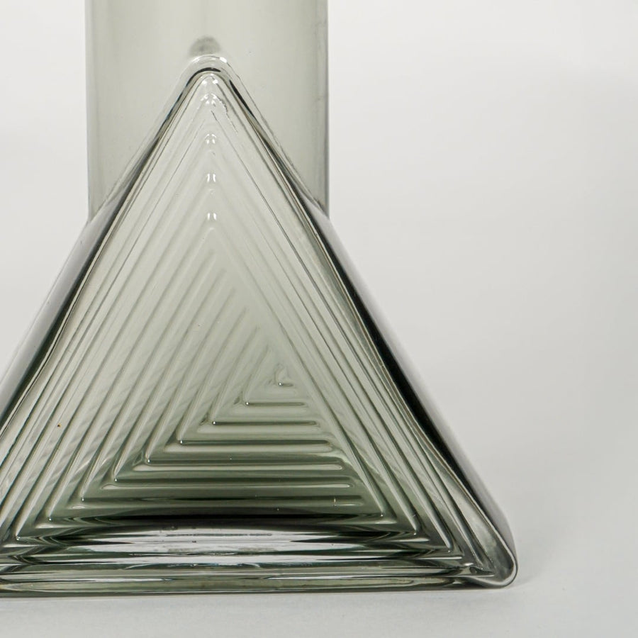 triangle geometric shape glass vase grey closeup