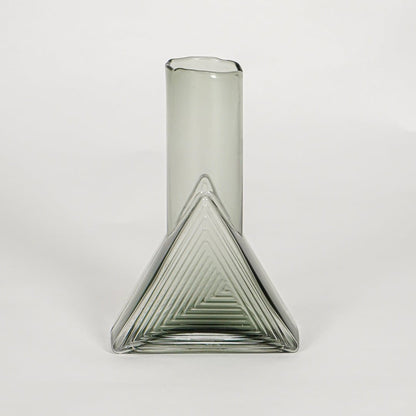 triangle geometric shape glass vase grey white background