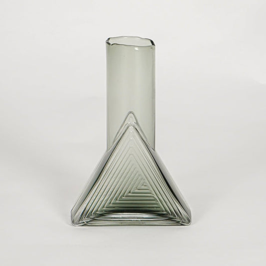triangle geometric shape glass vase grey white background