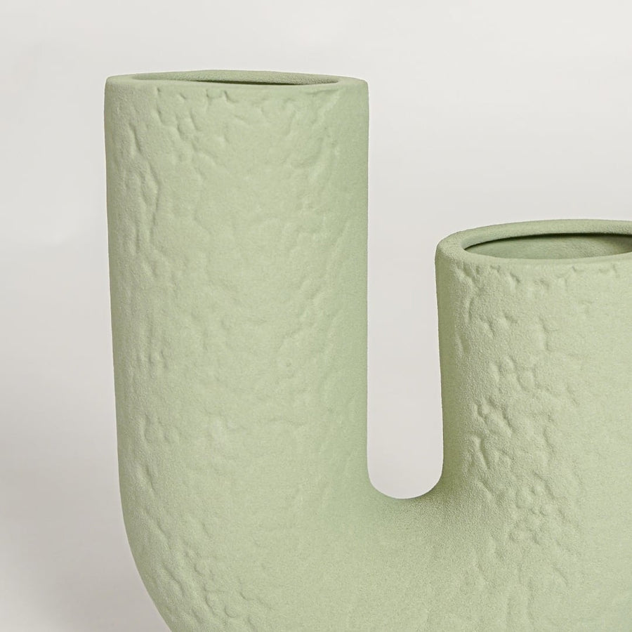 Close view of Tuba light green ceramic vase highlighting textured surface and smooth matte finish.