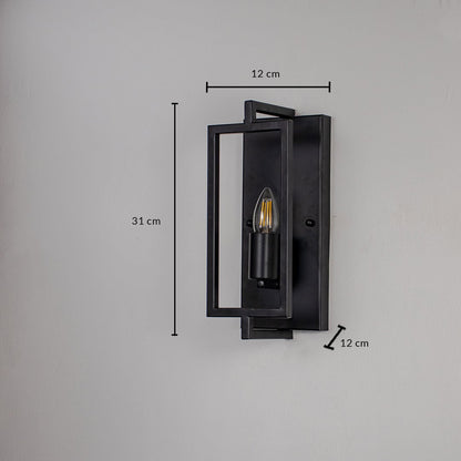 Black metal wall lantern showing 25 cm height 12 cm width and 10 cm projection suitable for exterior or interior wall mounting.