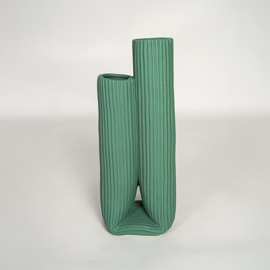 Modern green ceramic dual opening vase with ribbed surface ideal for shelf styling and contemporary decor display.