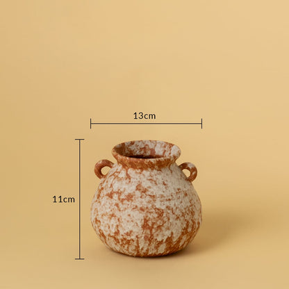 Small terracotta ceramic vase with dual side handles shown with 11cm height and 13cm width against beige background.